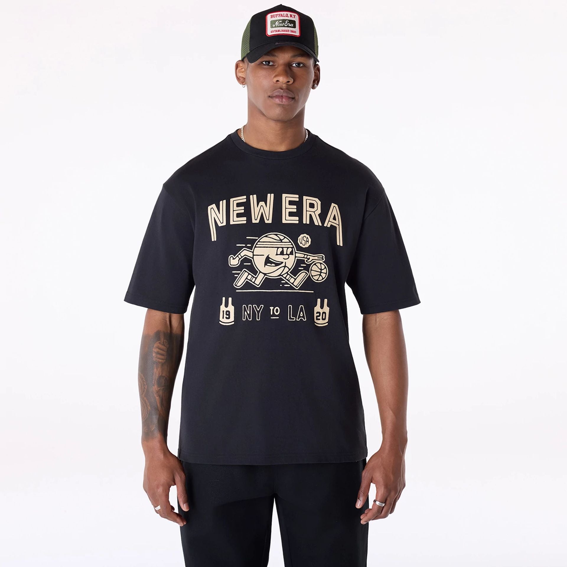 The Male model is wearing New Era Basketball Graphic Black T-Shirt 1