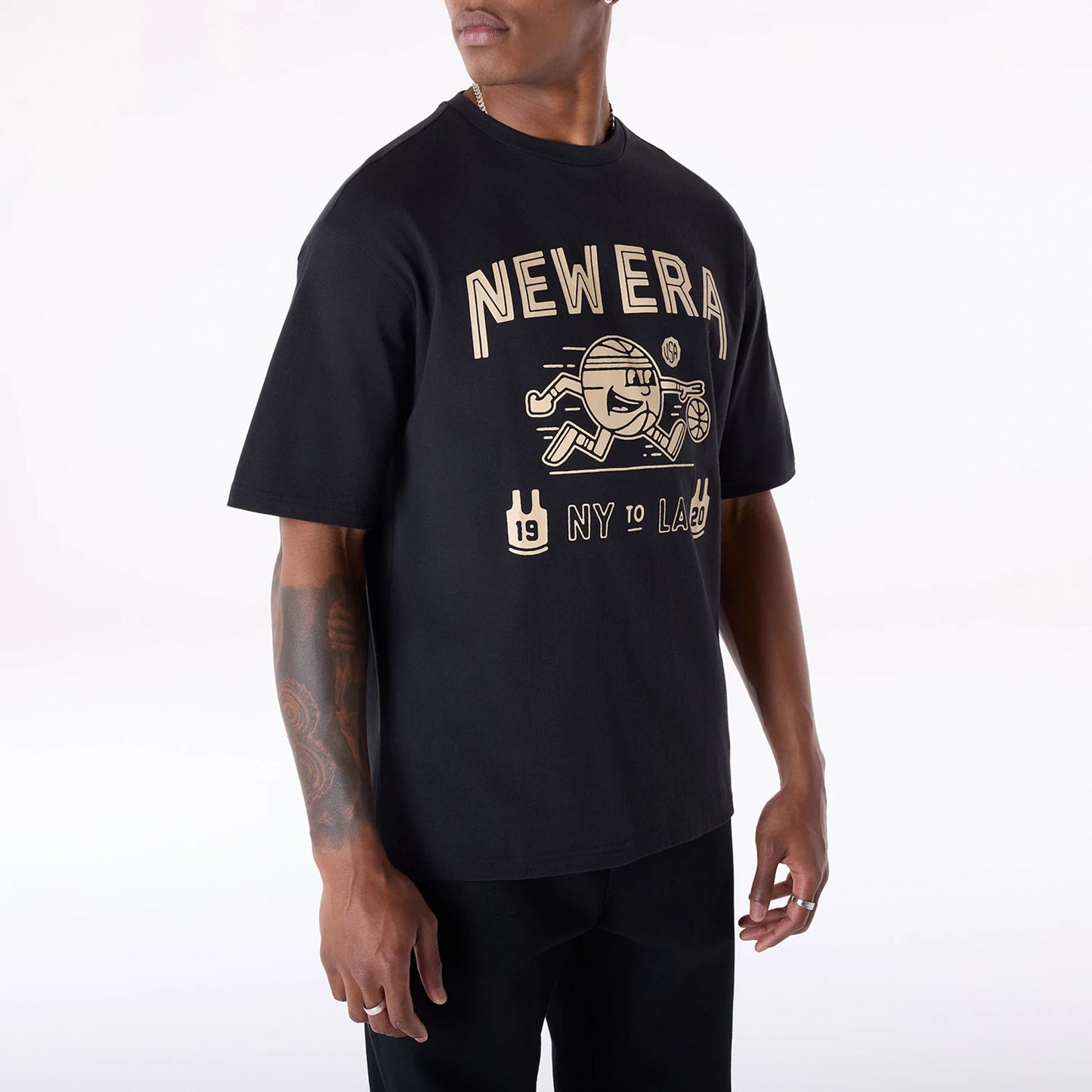 The Male model is wearing New Era Basketball Graphic Black T-Shirt 4