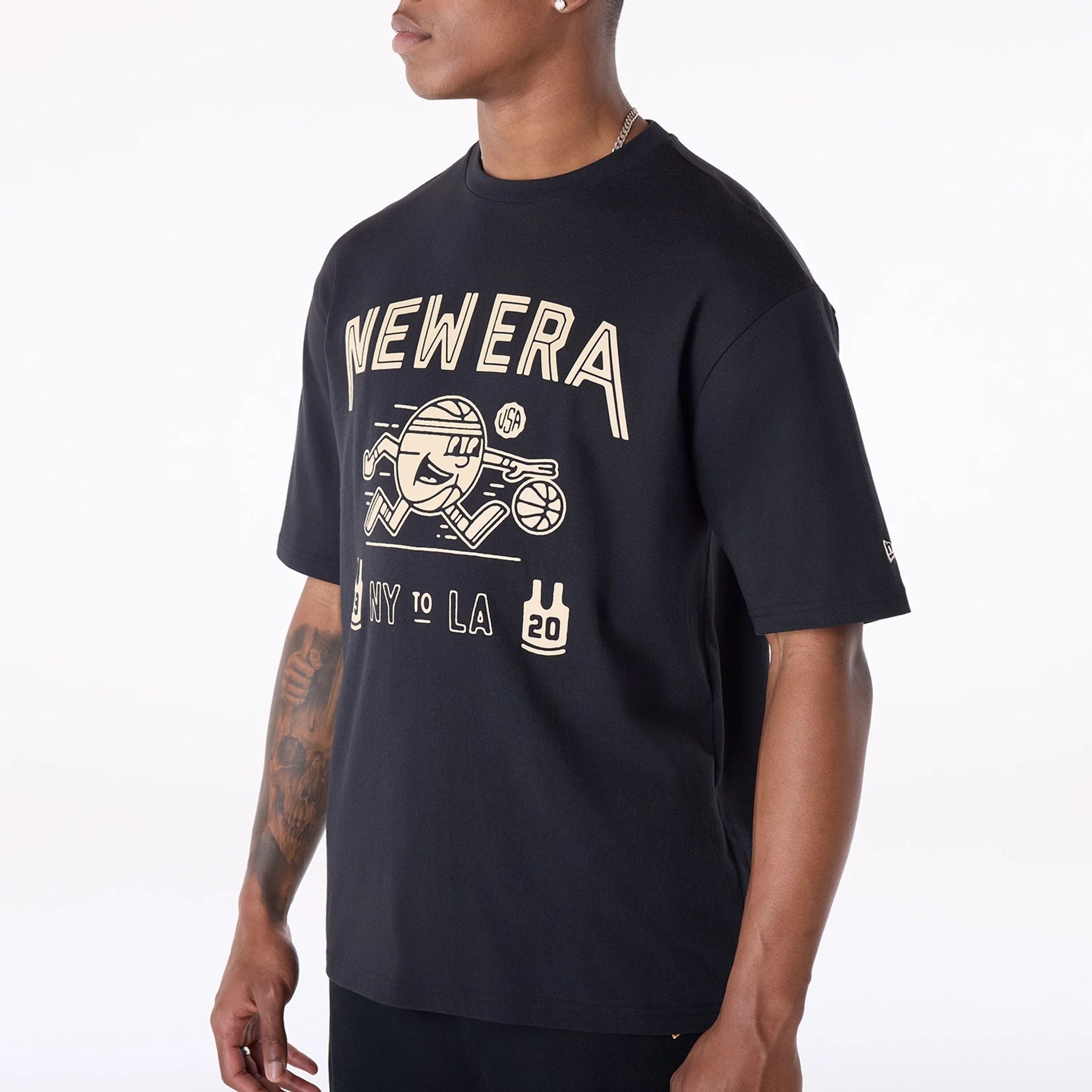 The Male model is wearing New Era Basketball Graphic Black T-Shirt 3