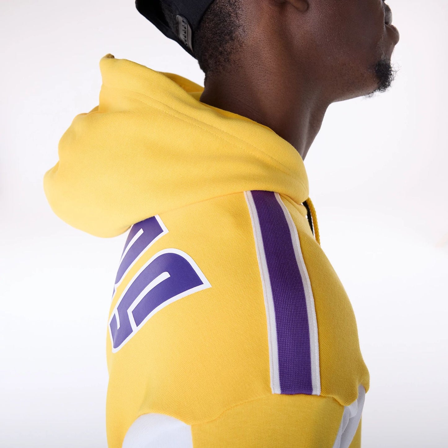 The Male model is wearing LA Lakers NBA Graphic Yellow Oversized Pullover Hoodie 5