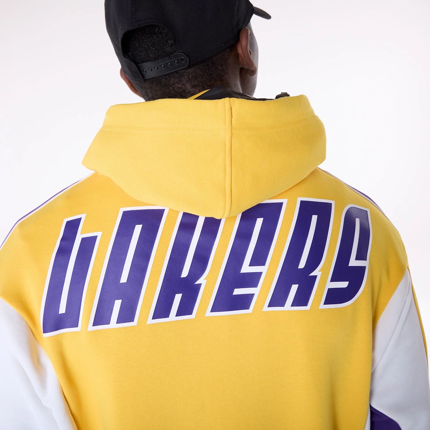 The Male model is wearing LA Lakers NBA Graphic Yellow Oversized Pullover Hoodie 4