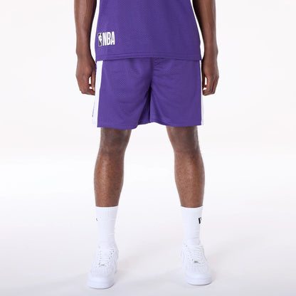 The Male model is wearing LA Lakers NBA Graphic Purple Mesh Shorts 1