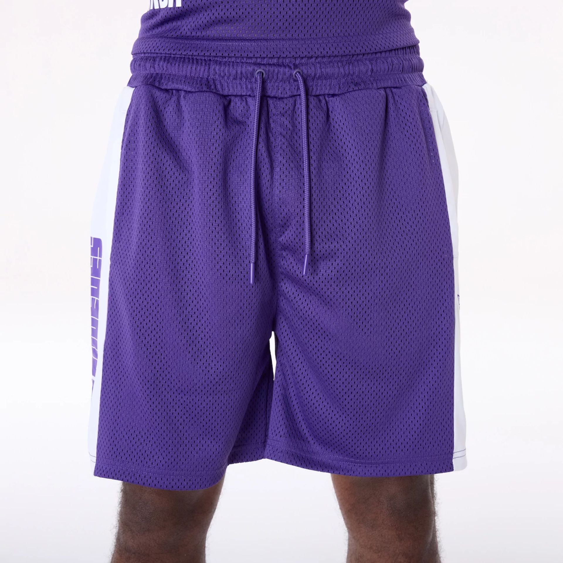 The Male model is wearing LA Lakers NBA Graphic Purple Mesh Shorts 6