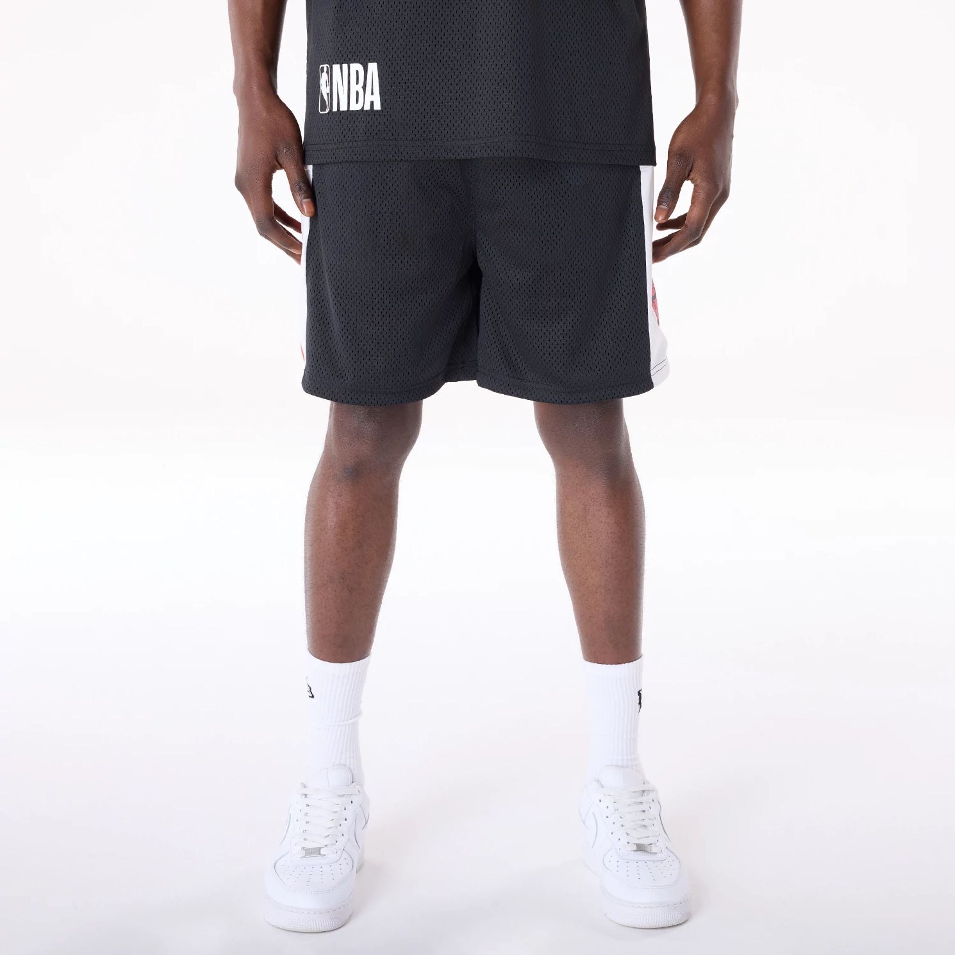 The Male model is wearing Chicago Bulls NBA Graphic Black Mesh Shorts 1