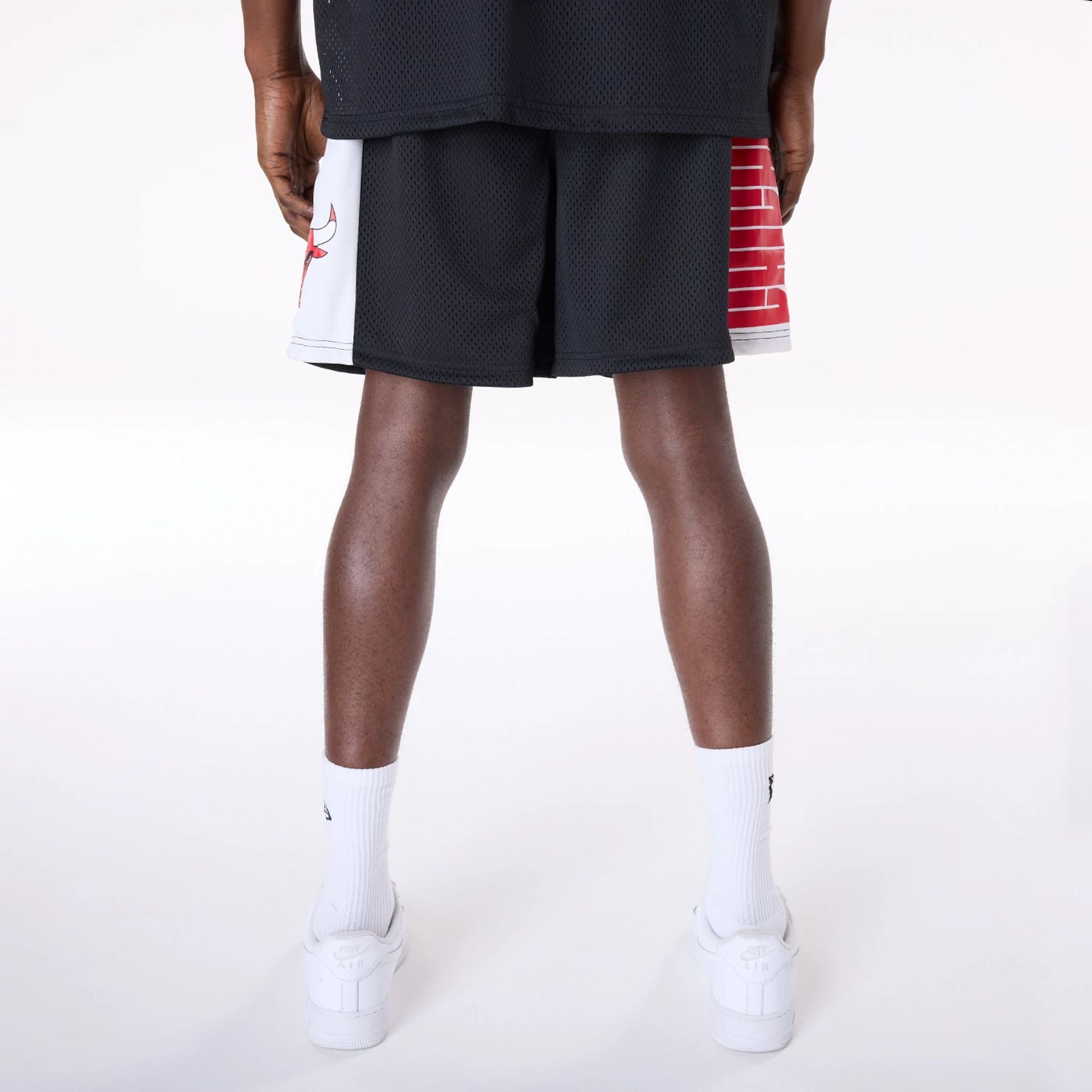 The Male model is wearing Chicago Bulls NBA Graphic Black Mesh Shorts 7