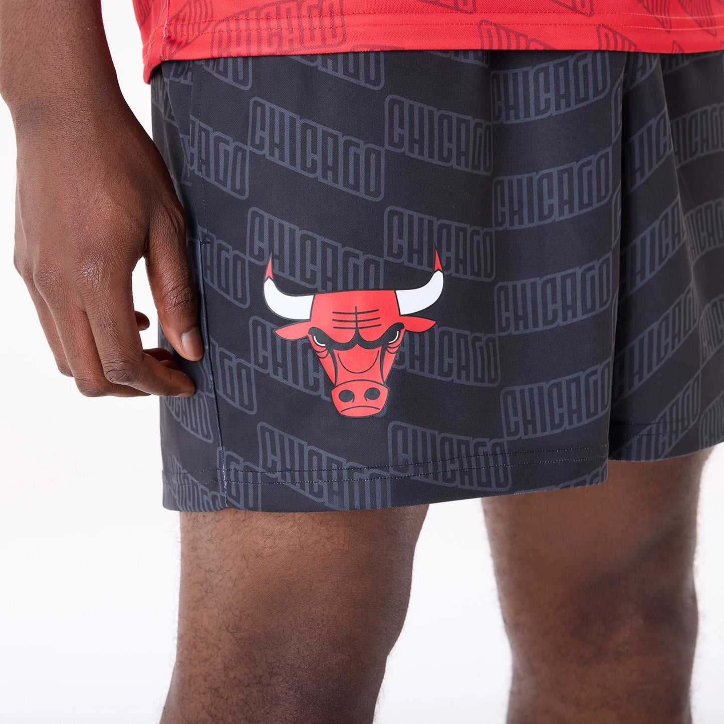 The Male model is wearing Chicago Bulls NBA All Over Print Graphic Black Shorts 3