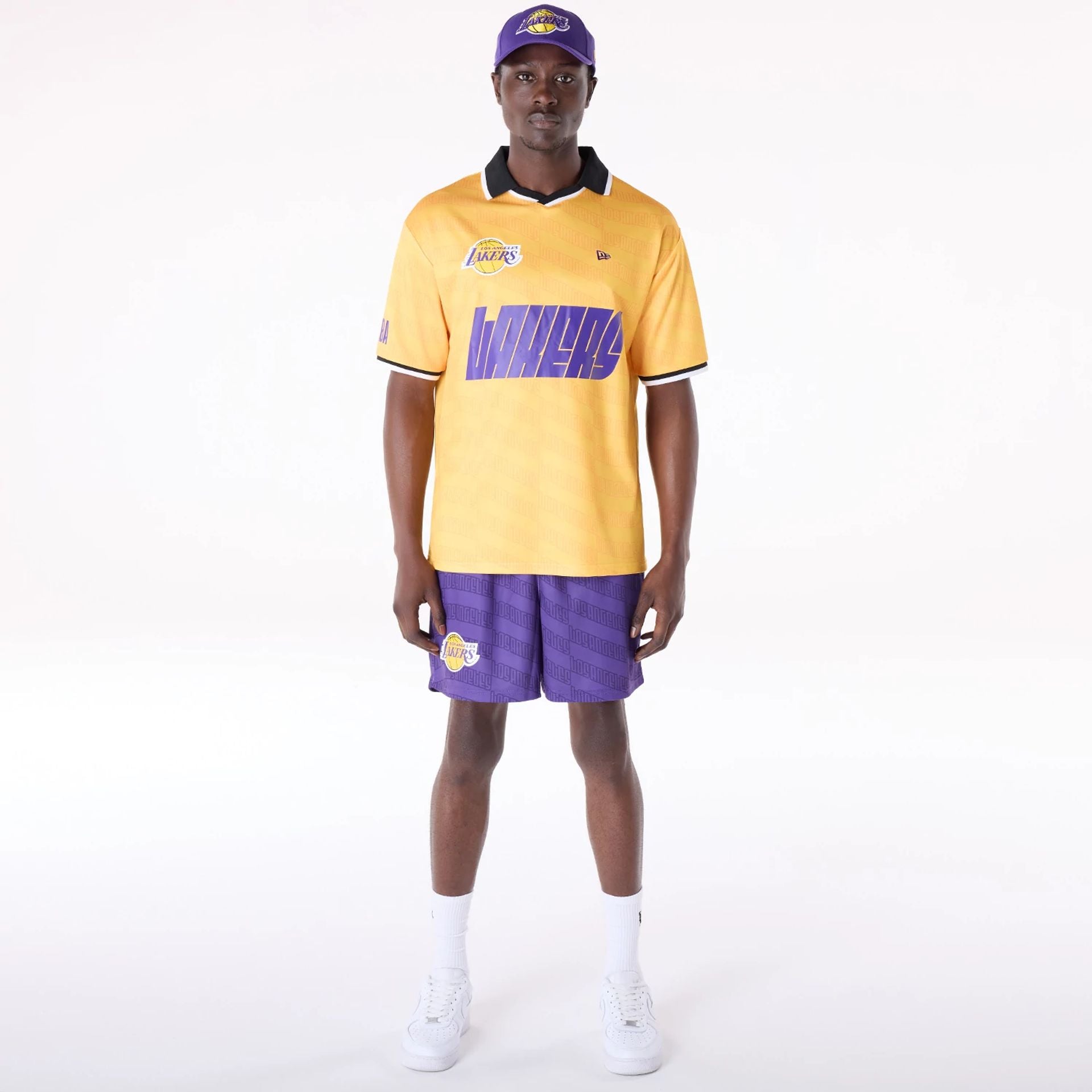 The Male model is wearing LA Lakers NBA All Over Print Graphic Purple Shorts 6