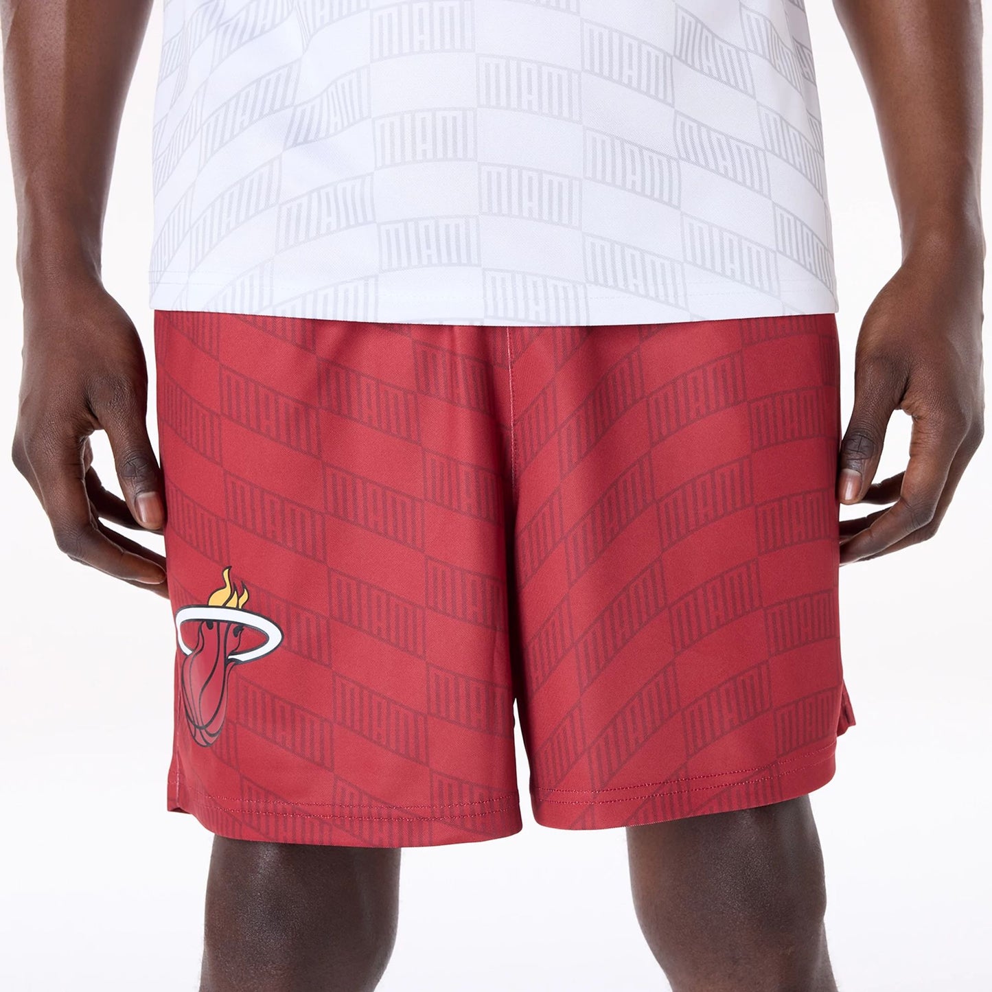 The Male model is wearing Miami Heat NBA All Over Print Graphic Dark Red Shorts 8