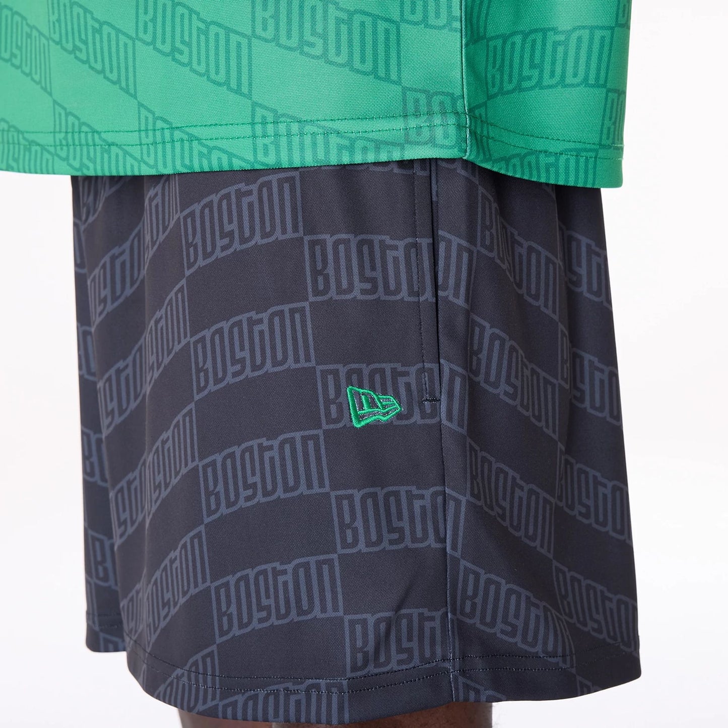 The Male model is wearing Boston Celtics NBA All Over Print Graphic Black Shorts 4