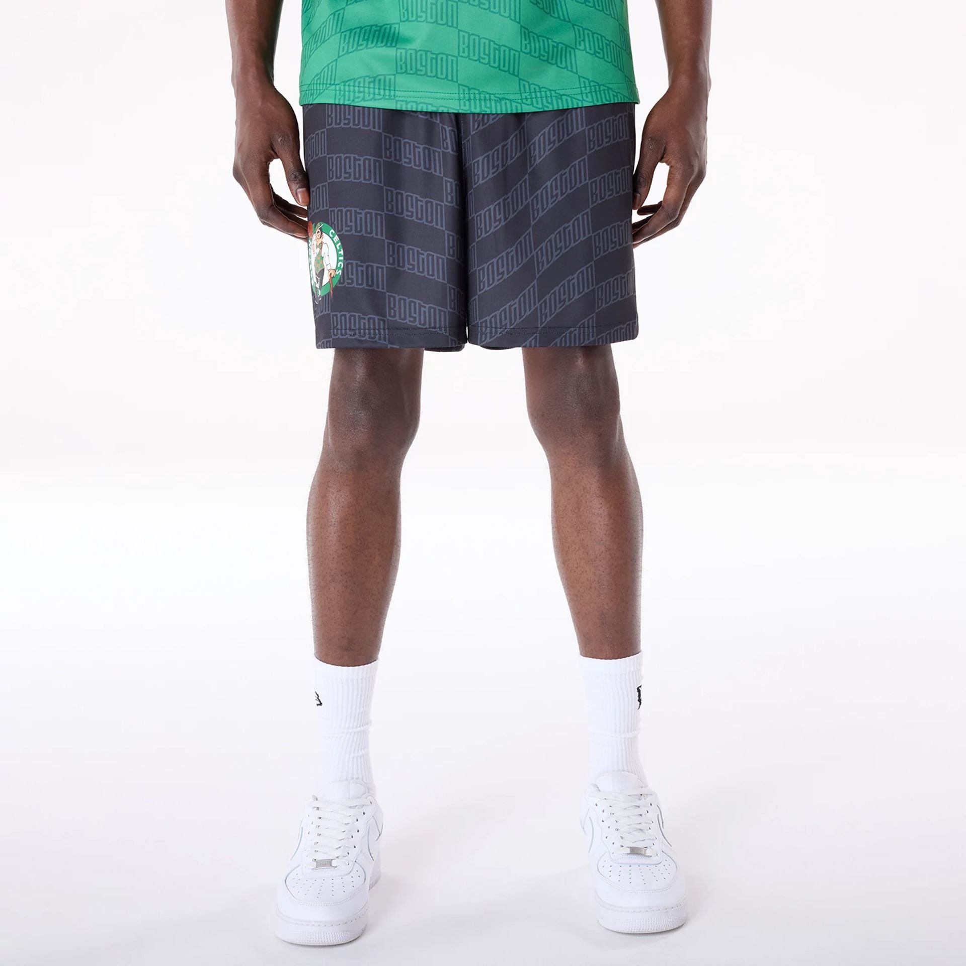 The Male model is wearing Boston Celtics NBA All Over Print Graphic Black Shorts 1