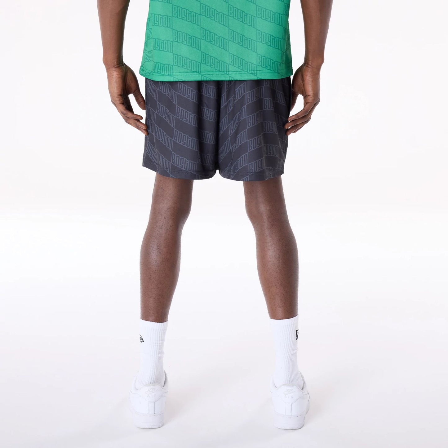 The Male model is wearing Boston Celtics NBA All Over Print Graphic Black Shorts 7