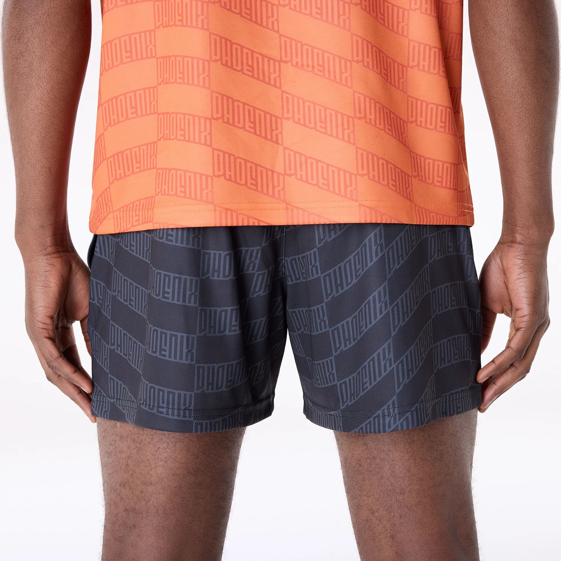 The Male model is wearing Phoenix Suns NBA All Over Print Graphic Black Shorts 4