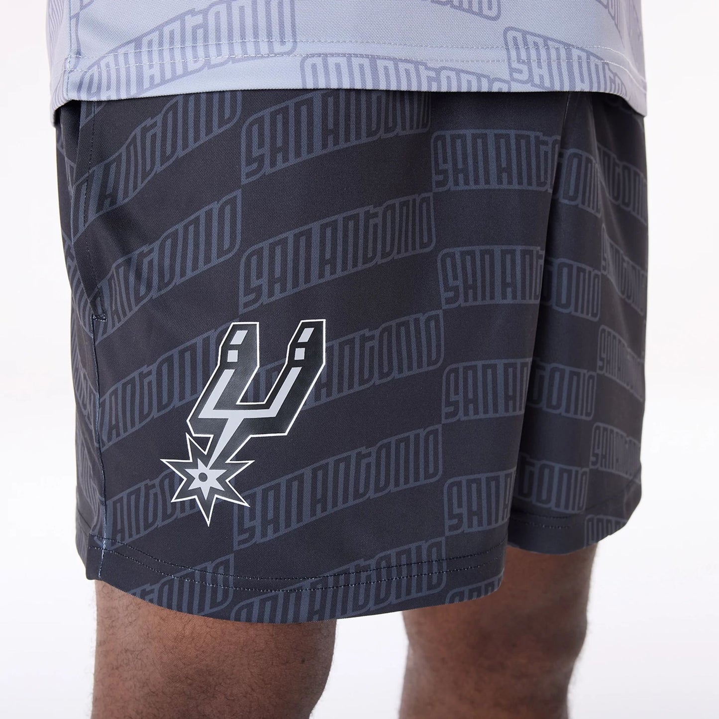 The Male model is wearing San Antonio Spurs NBA All Over Print Graphic Black Shorts 5