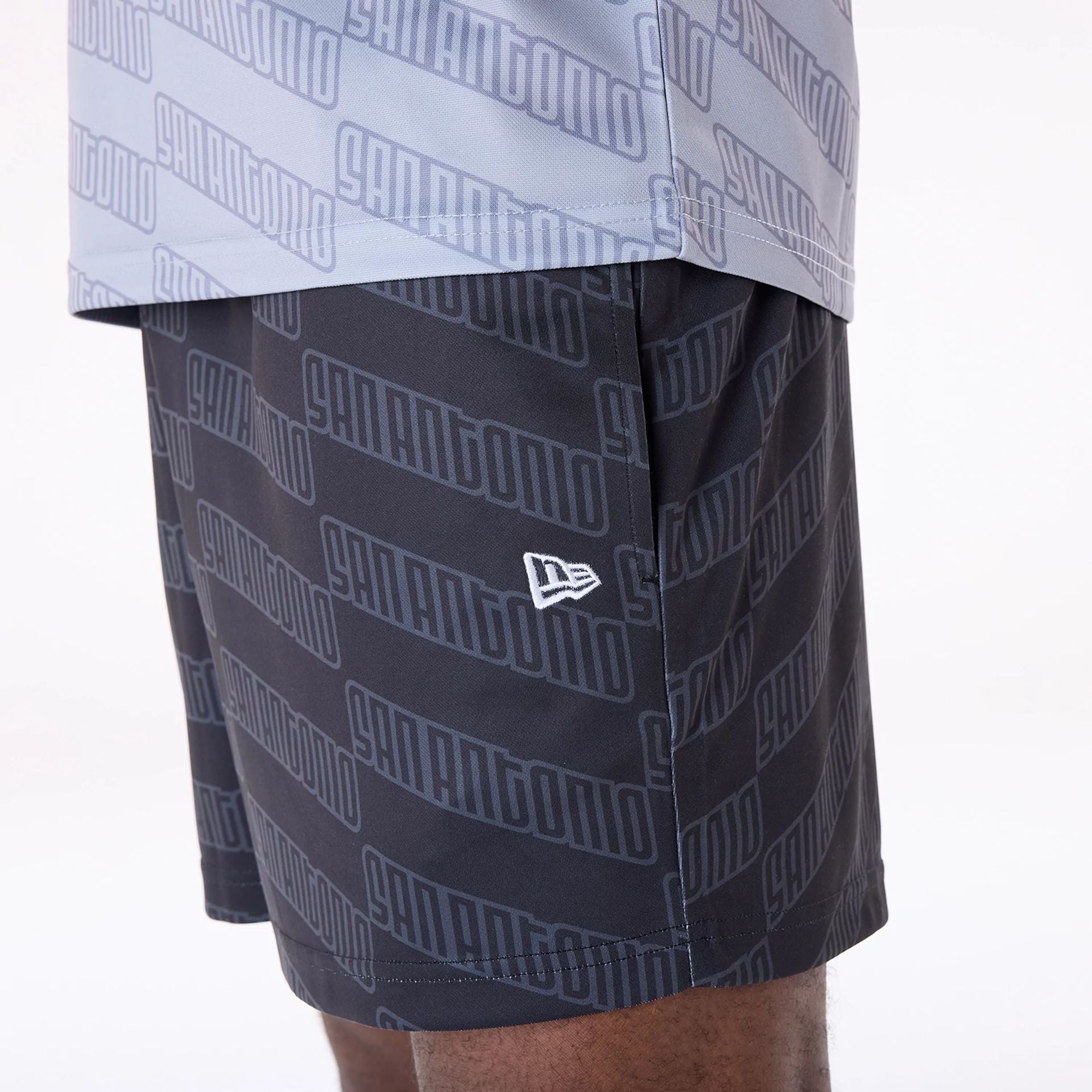 The Male model is wearing San Antonio Spurs NBA All Over Print Graphic Black Shorts 8