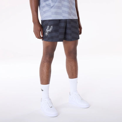 The Male model is wearing San Antonio Spurs NBA All Over Print Graphic Black Shorts 1