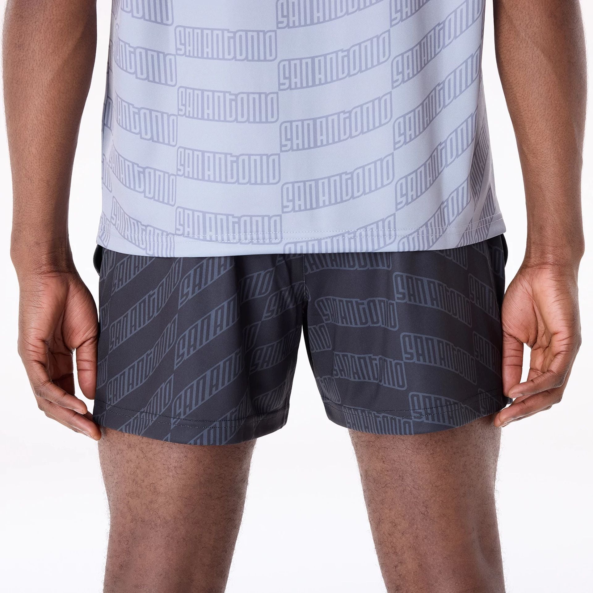 The Male model is wearing San Antonio Spurs NBA All Over Print Graphic Black Shorts 6