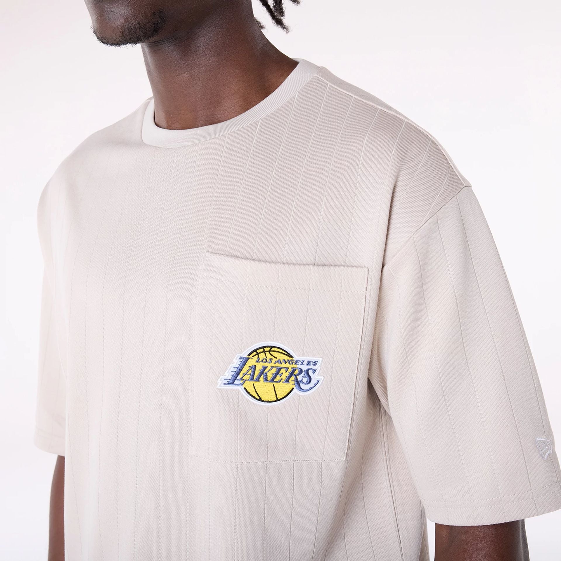 The Male model is wearing LA Lakers NBA Pinstripe Cream Oversized T-Shirt 7