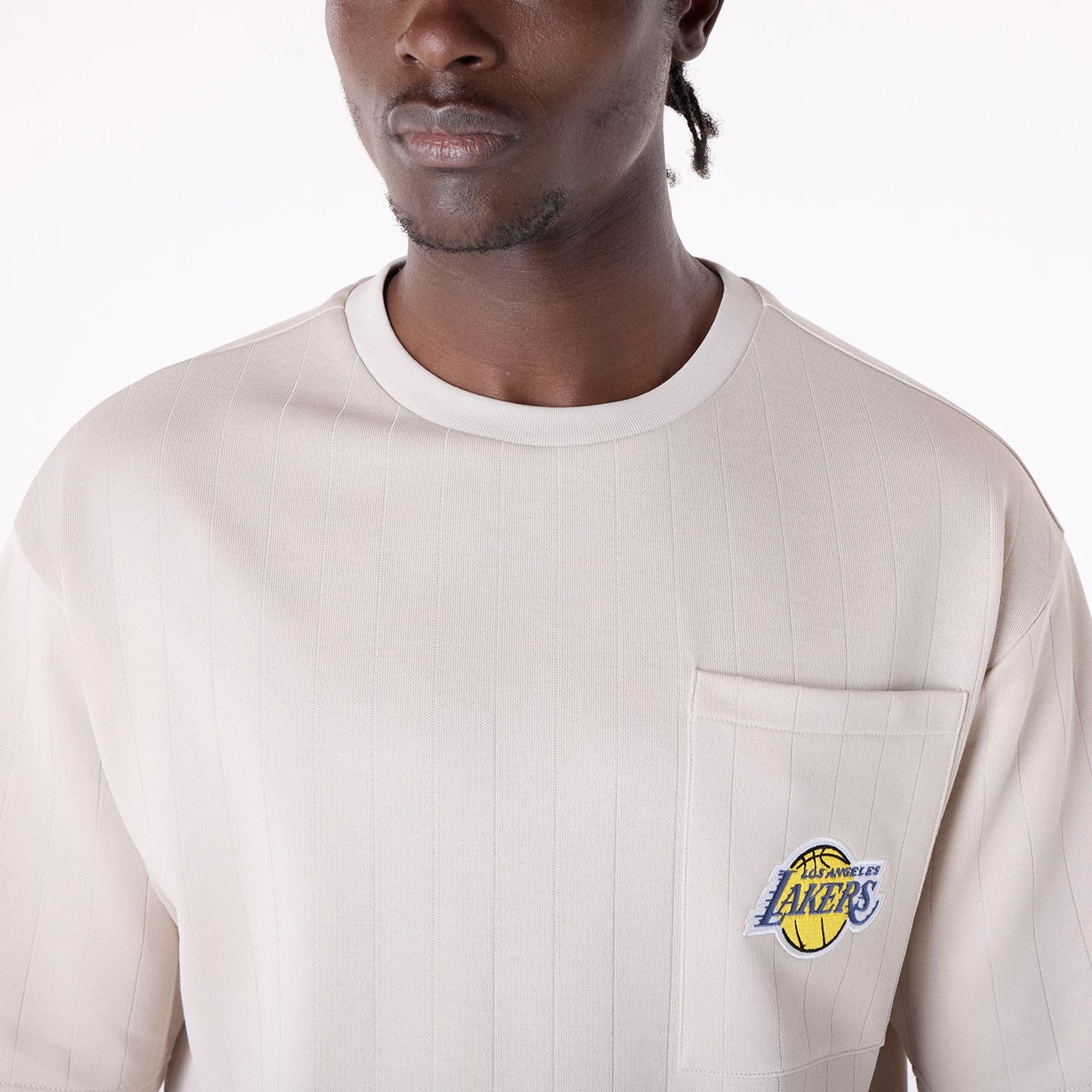 The Male model is wearing LA Lakers NBA Pinstripe Cream Oversized T-Shirt 4