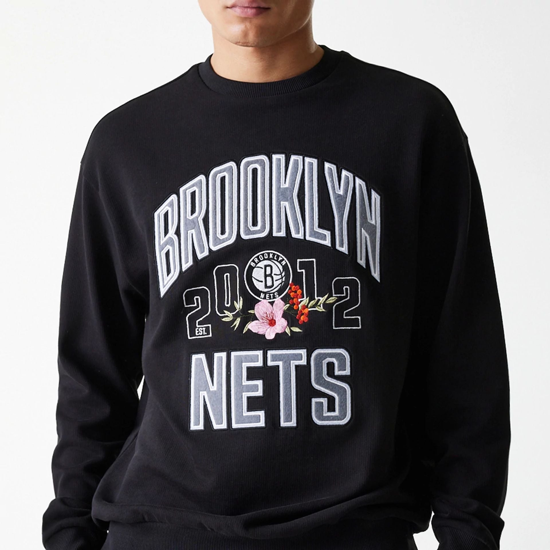 The Male model is wearing Brooklyn Nets NBA Floral Black Oversized Crew Neck Sweater 3