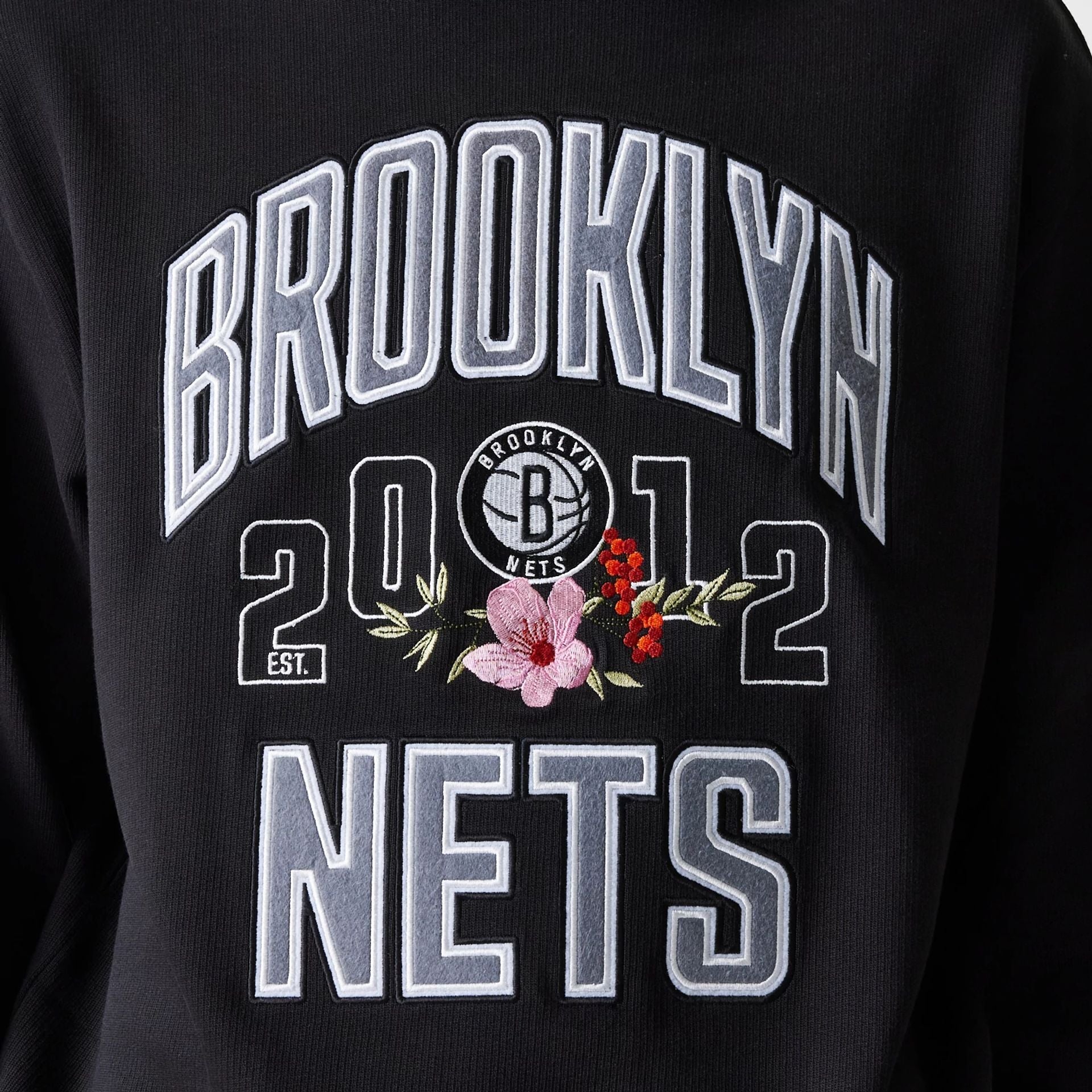 The Male model is wearing Brooklyn Nets NBA Floral Black Oversized Crew Neck Sweater 5