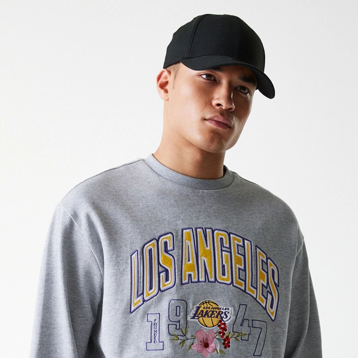 The Male model is wearing LA Lakers NBA Floral Grey Oversized Crew Neck Sweater 3