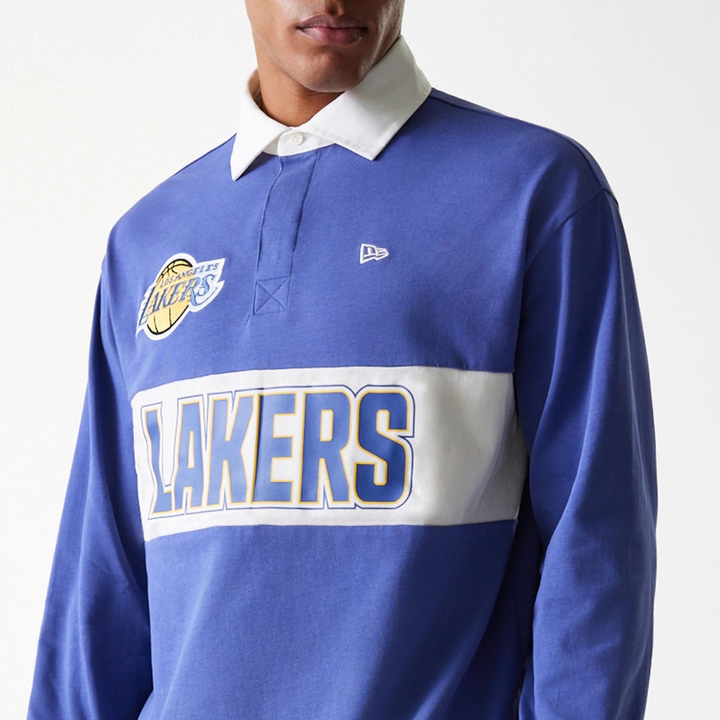 The Male model is wearing LA Lakers NBA Rugby Dark Blue Long Sleeve Polo 7