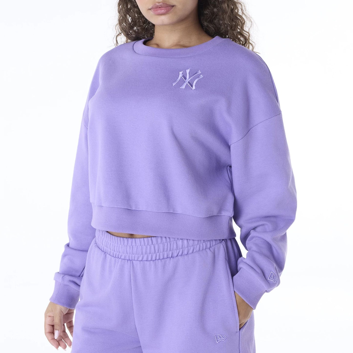 The Female model is wearing New York Yankees Womens MLB League Essential Purple Crew Neck Sweater 7