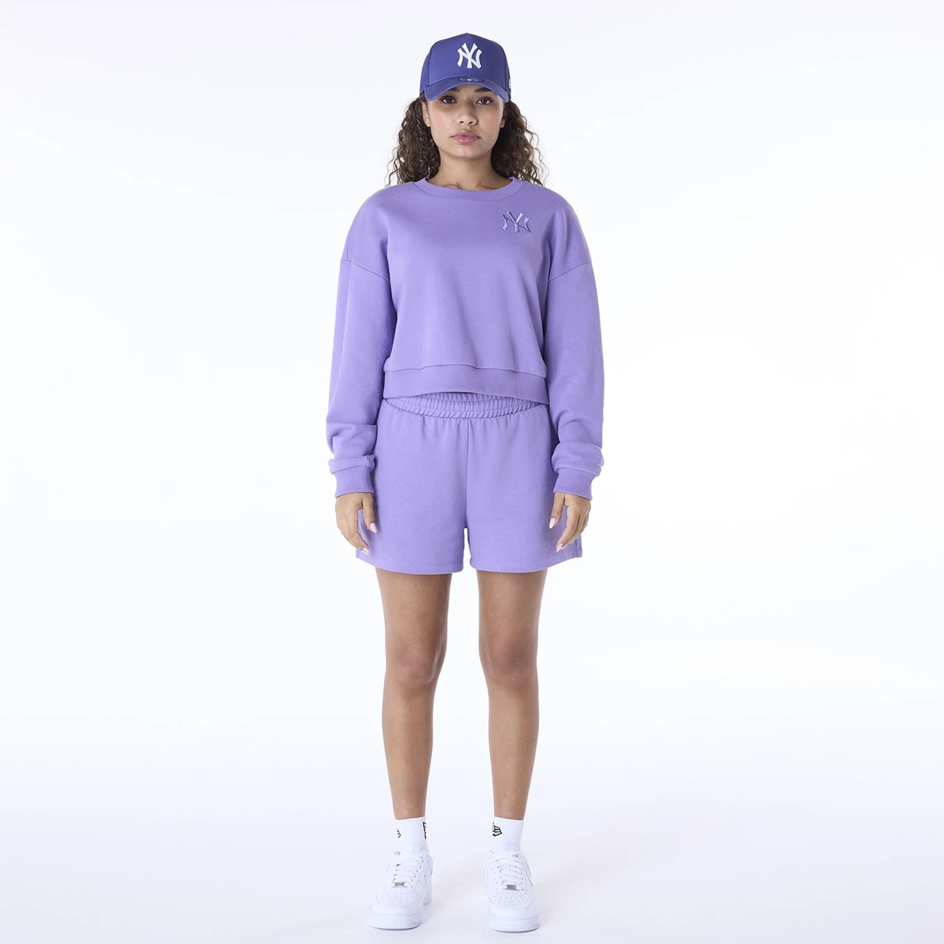 The Female model is wearing New York Yankees Womens MLB League Essential Purple Crew Neck Sweater 5