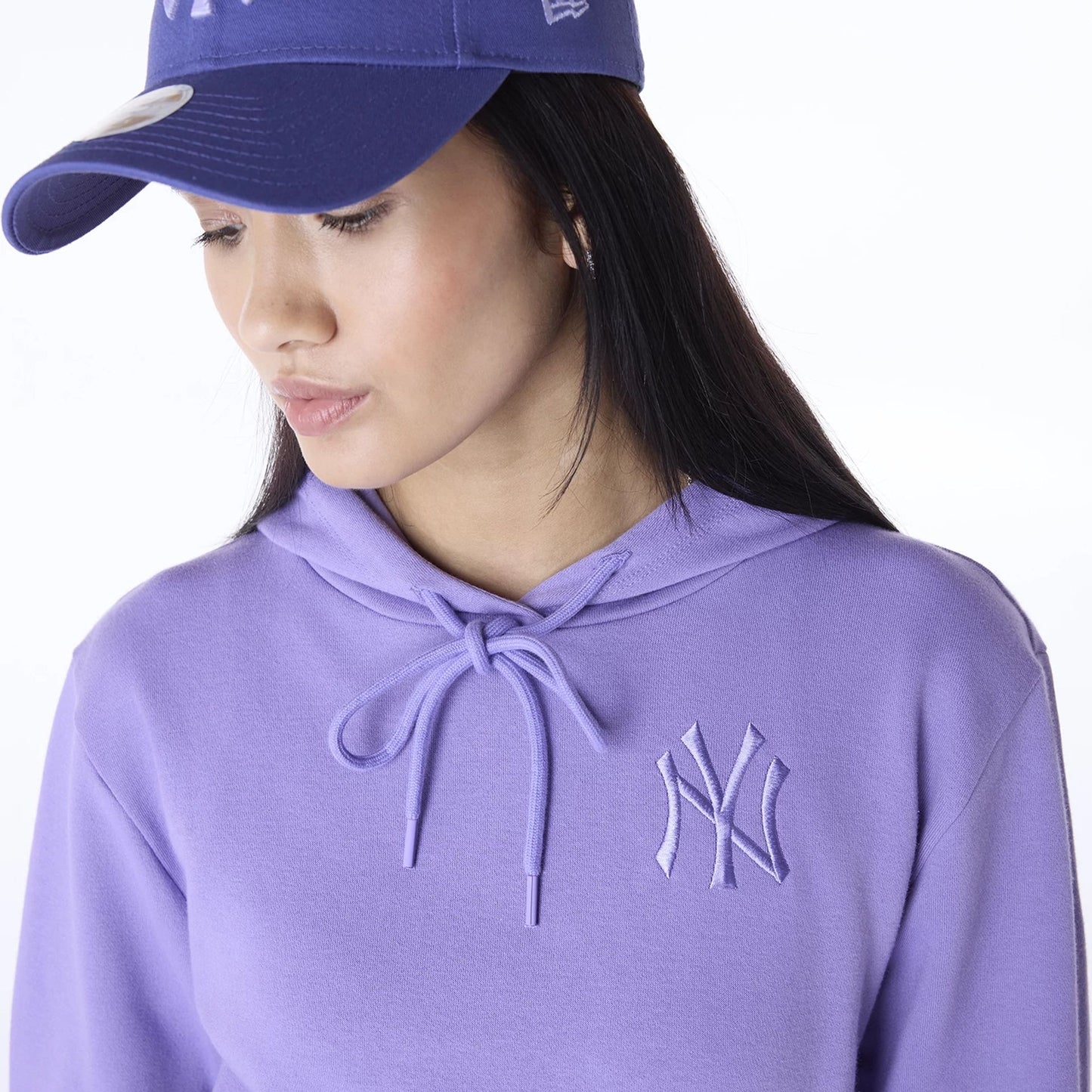 The Female model is wearing New York Yankees Womens MLB League Essential Purple Pullover Hoodie 4