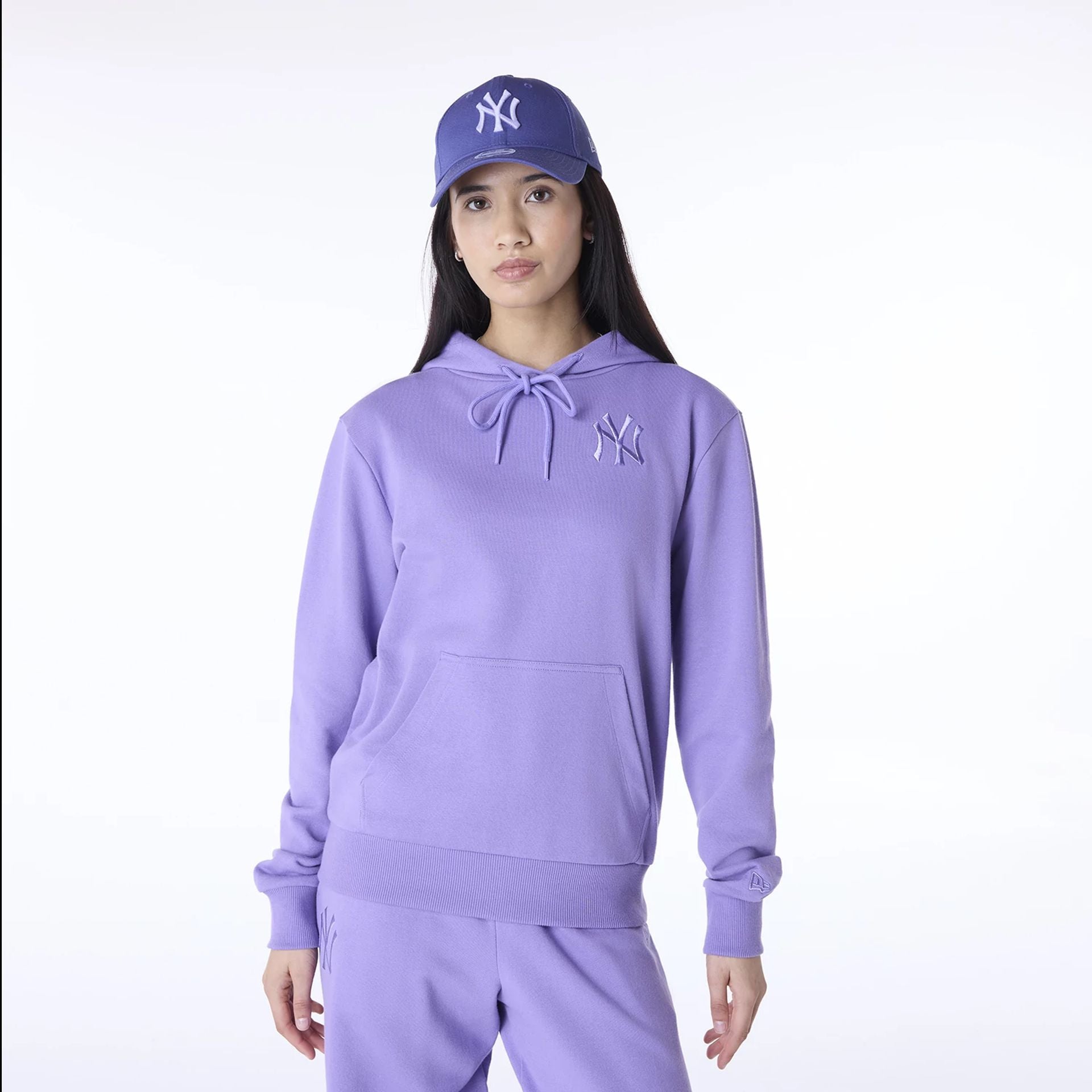 The Female model is wearing New York Yankees Womens MLB League Essential Purple Pullover Hoodie 1