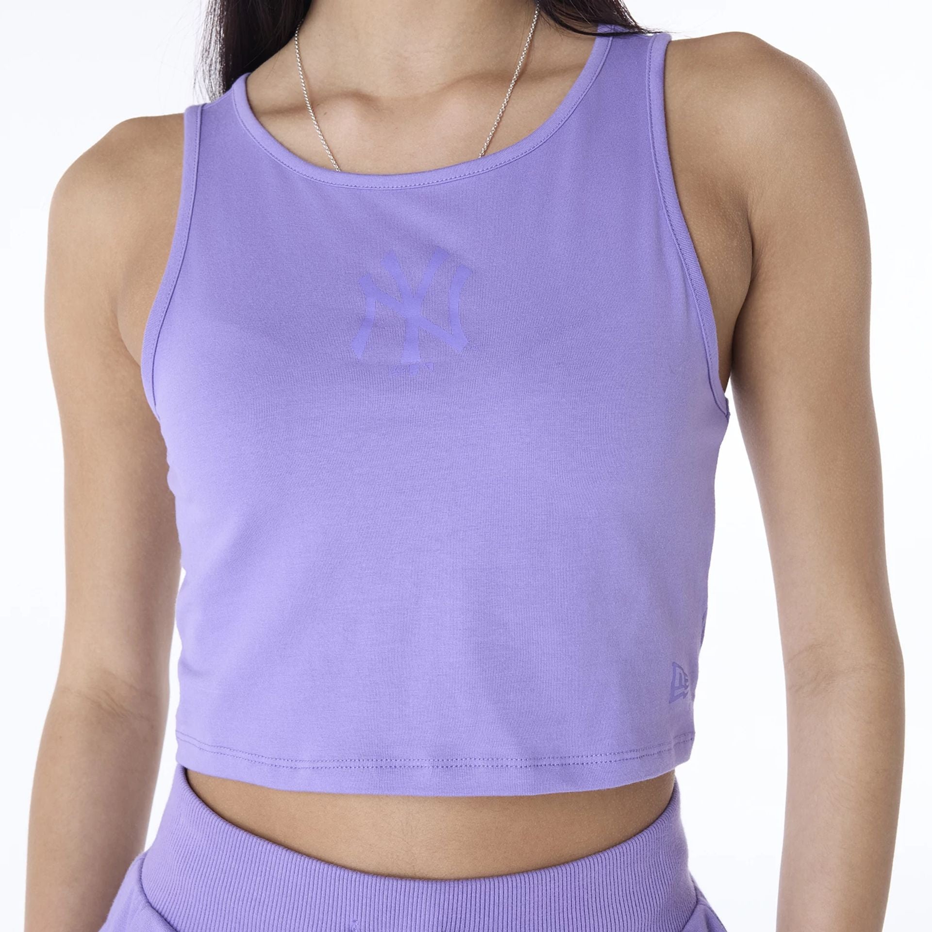 The Female model is wearing New York Yankees Womens MLB League Essential Purple Vest 3