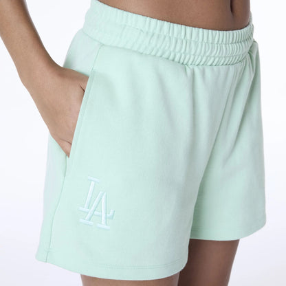 The Female model is wearing LA Dodgers Womens MLB League Essential Pastel Green Shorts 6