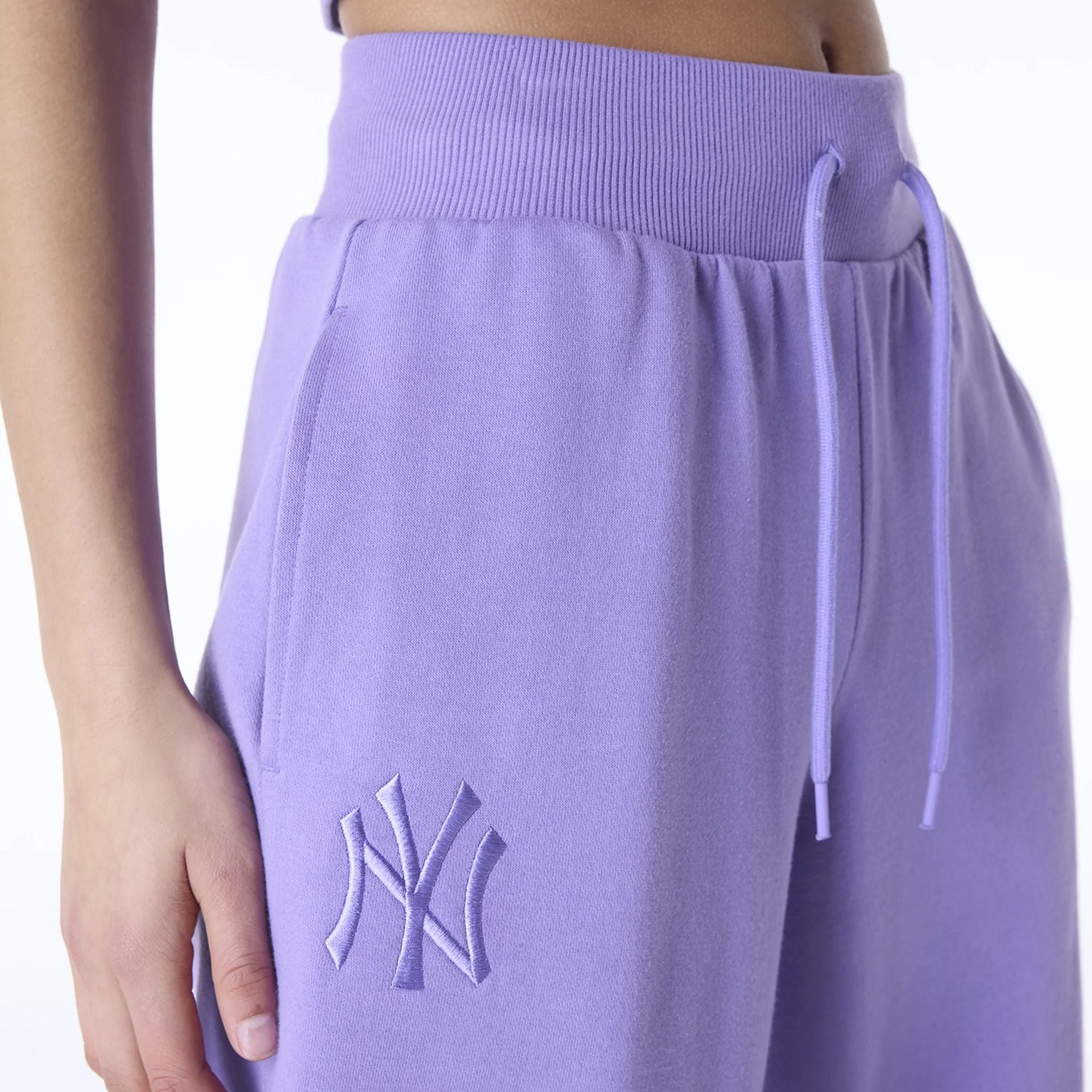 The Female model is wearing New York Yankees Womens MLB League Essential Purple Fleece Joggers 3