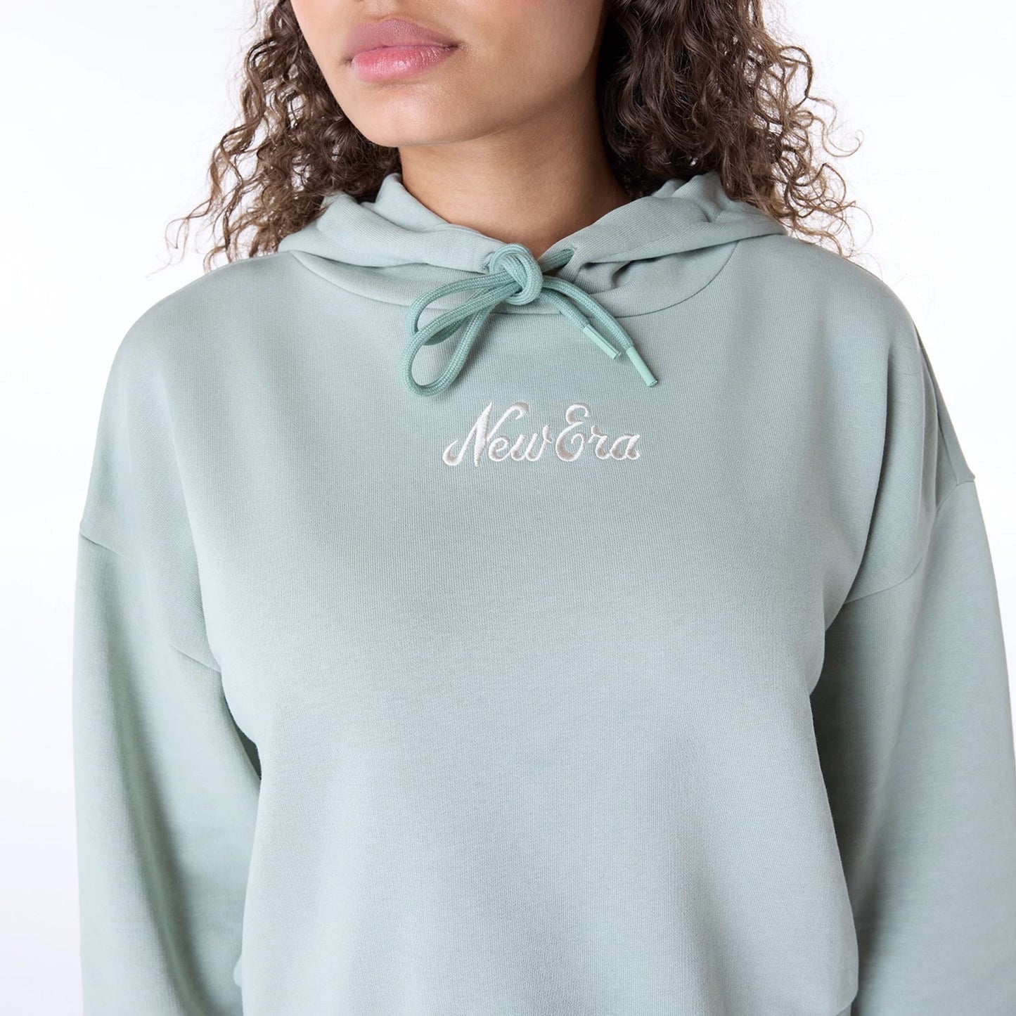 The Female model is wearing Womens New Era Script Pastel Green Pullover Hoodie 3