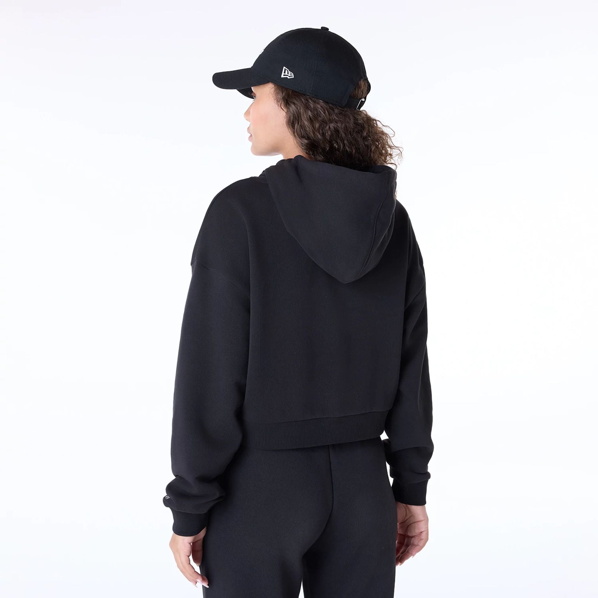 The Female model is wearing Womens New Era Script Black Pullover Hoodie 7