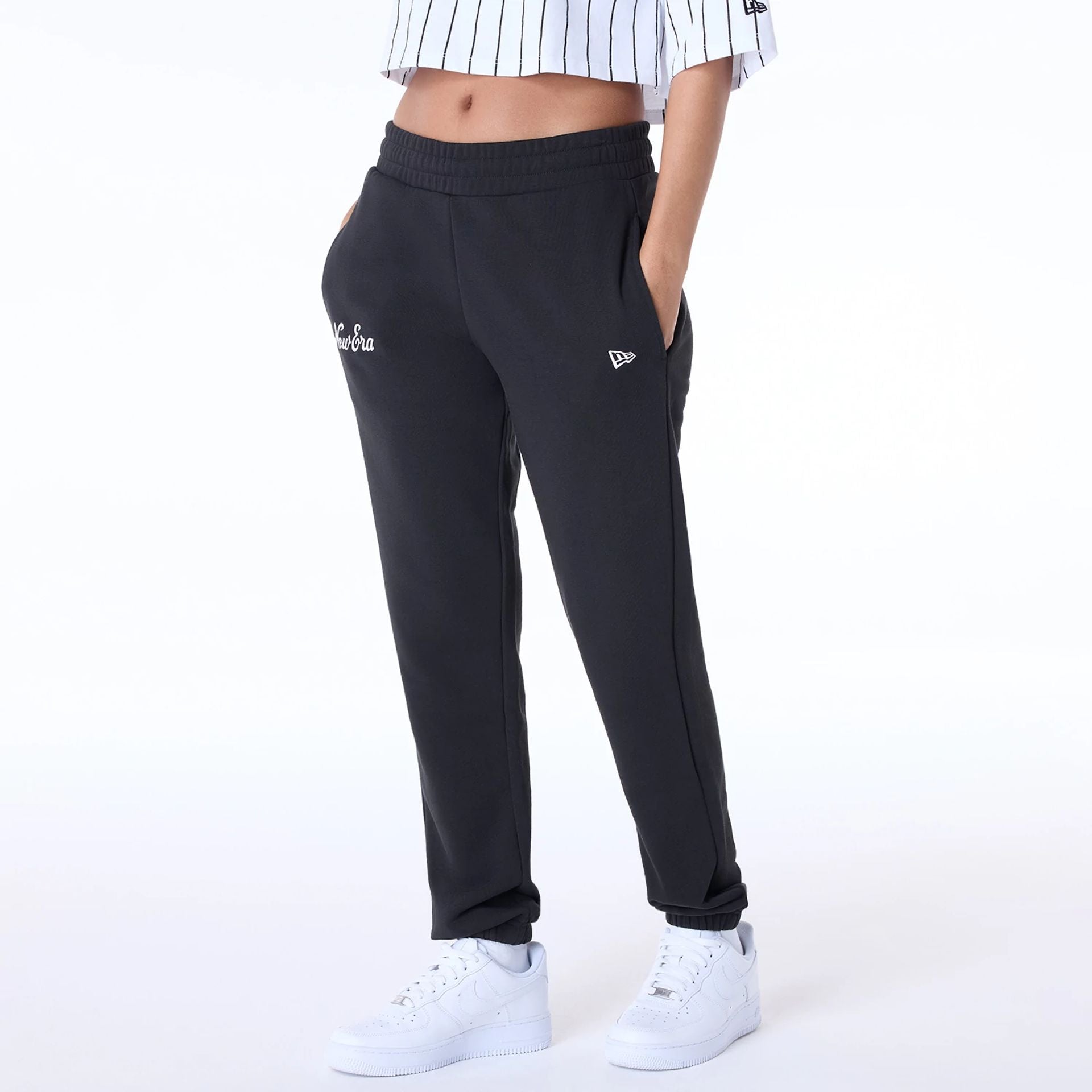 The Female model is wearing Womens New Era Script Black Joggers 2