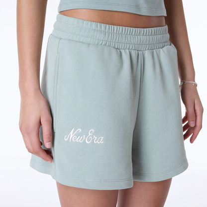 The Female model is wearing Womens New Era Script Pastel Green Shorts 3