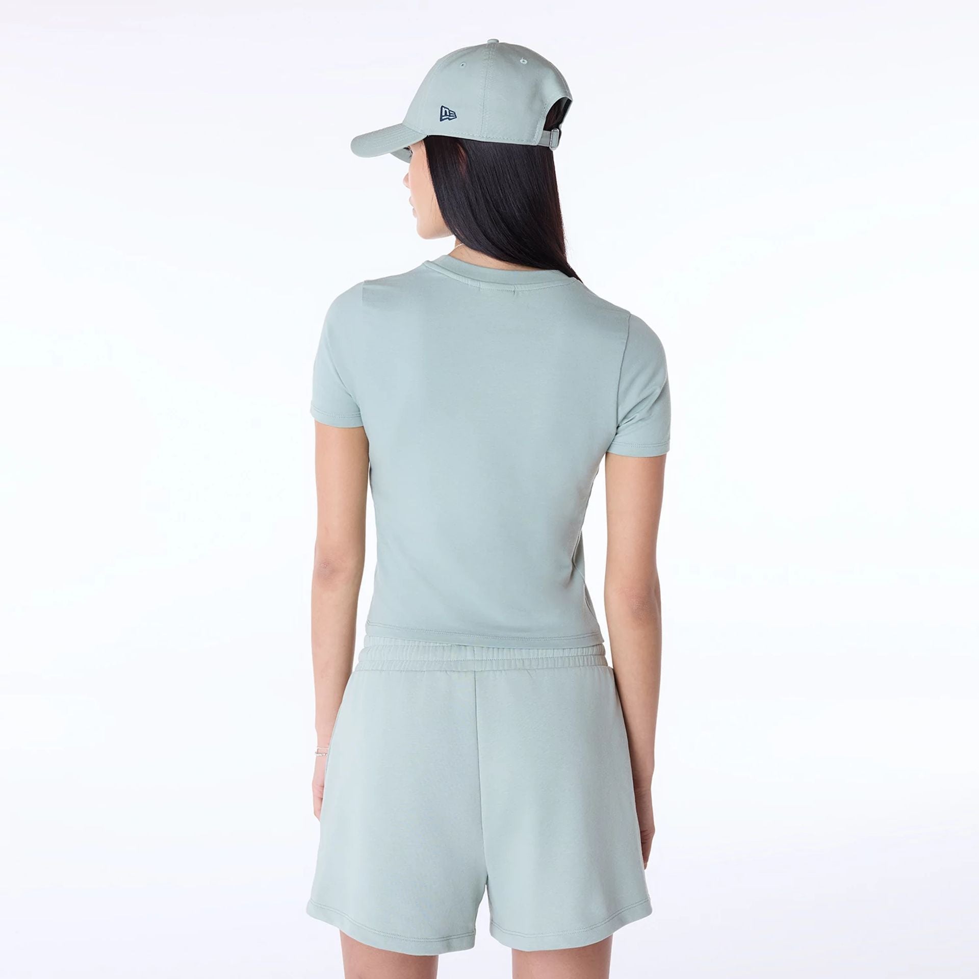 The Female model is wearing Womens New Era Slim Pastel Green T-Shirt 7