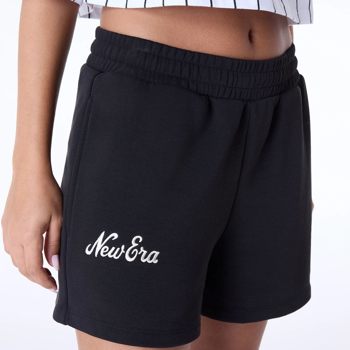 The Female model is wearing Womens New Era Script Black Shorts 5