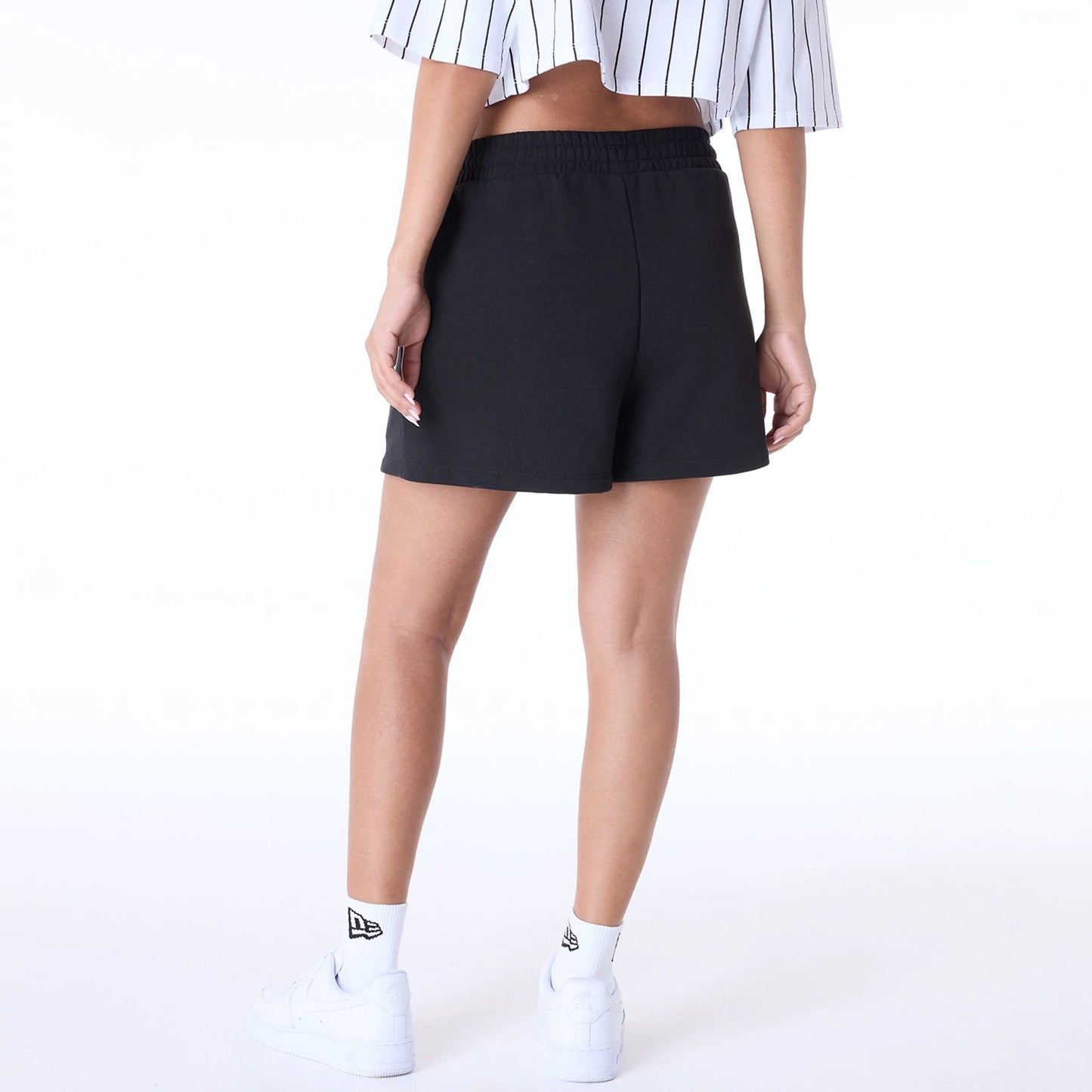 The Female model is wearing Womens New Era Script Black Shorts 7