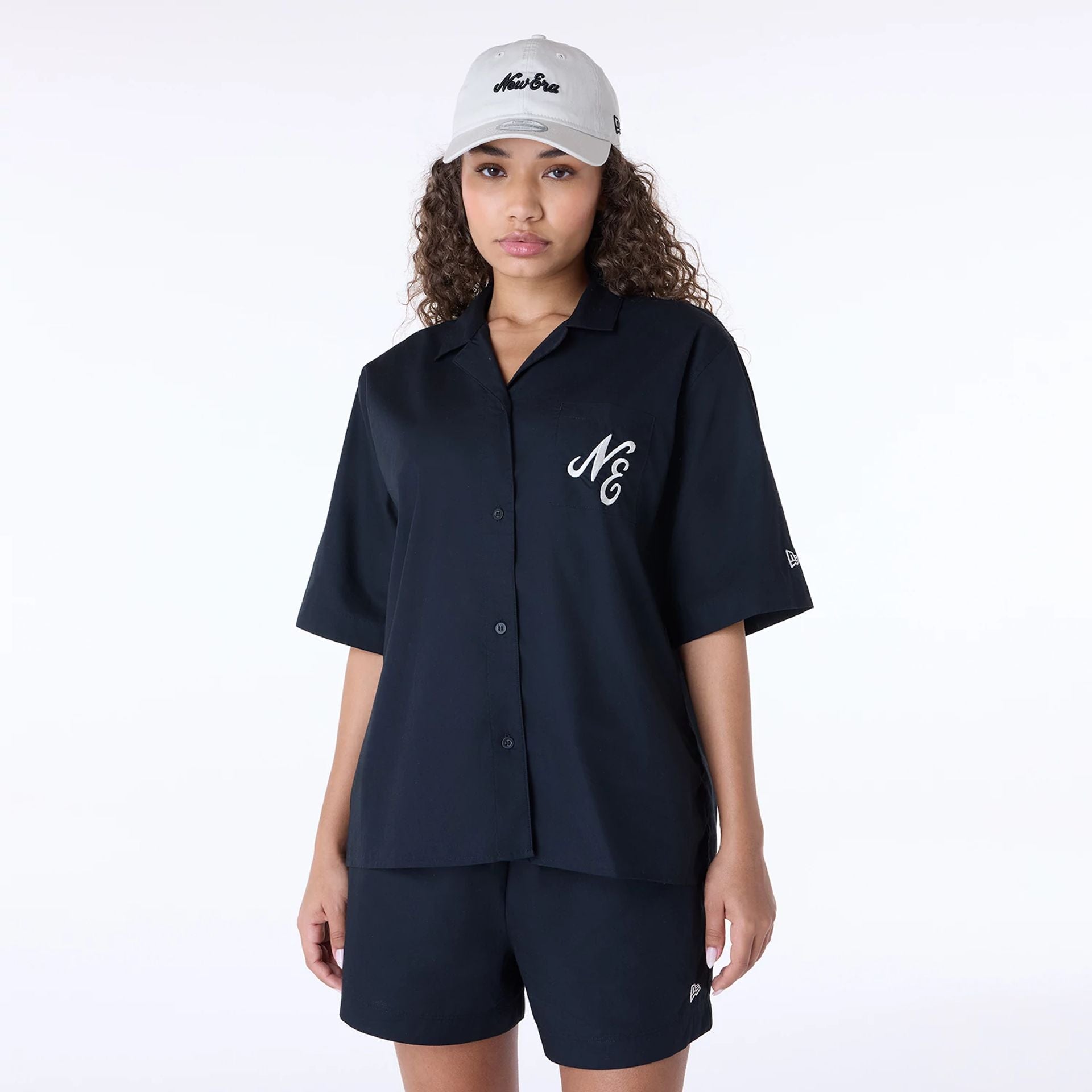 The Female model is wearing Womens New Era Revere Black T-Shirt 1