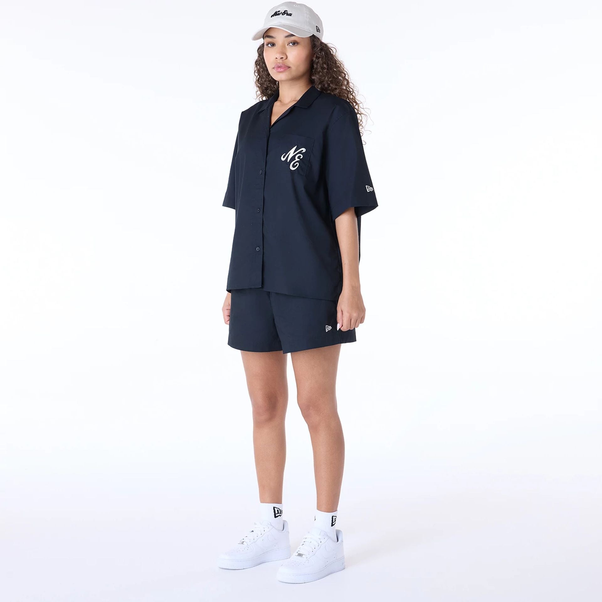 The Female model is wearing Womens New Era Revere Black T-Shirt 8