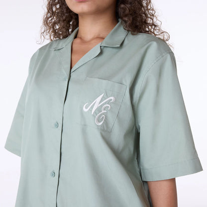 The Female model is wearing Womens New Era Revere Pastel Green T-Shirt 2