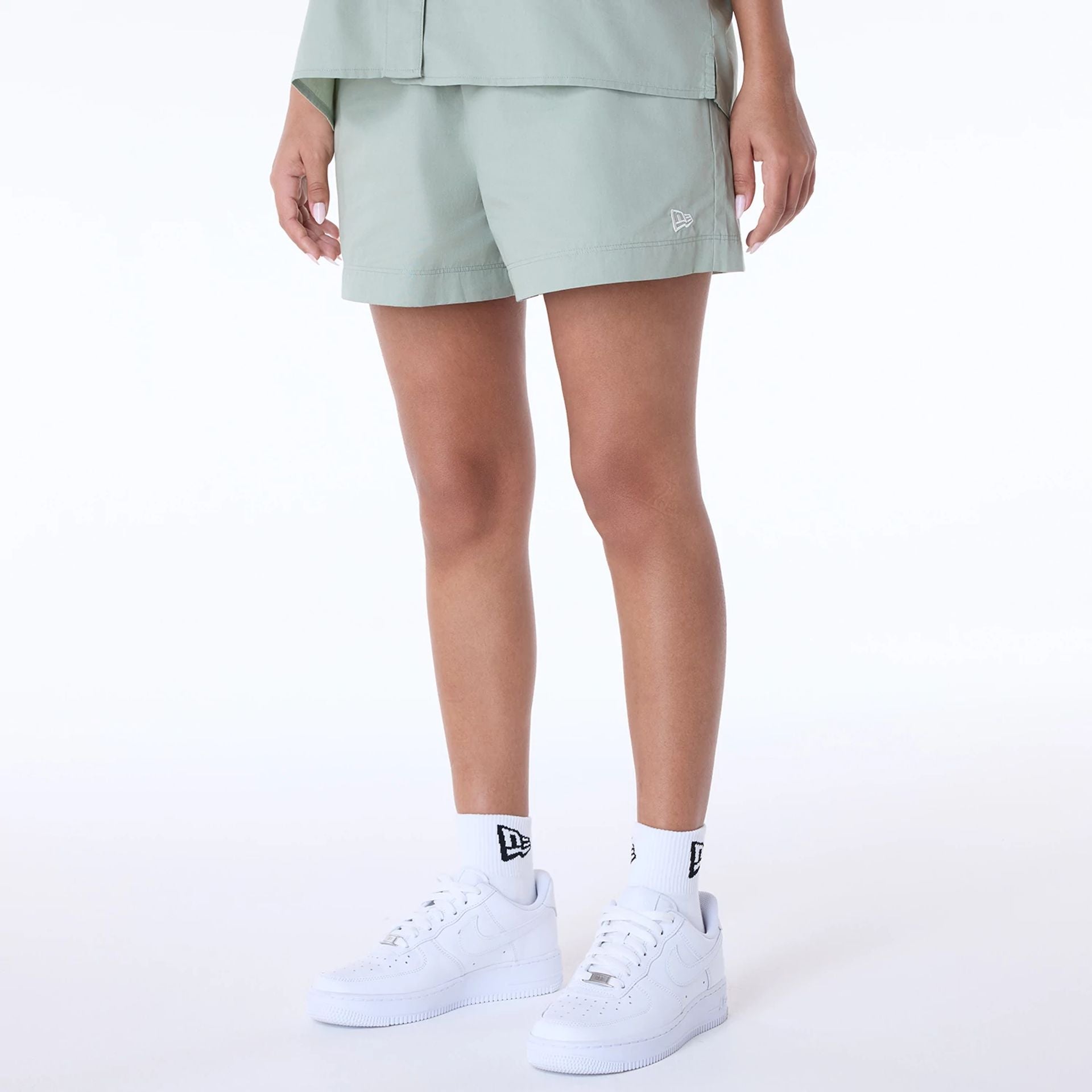 The Female model is wearing Womens New Era Cotton Pastel Green Shorts 1