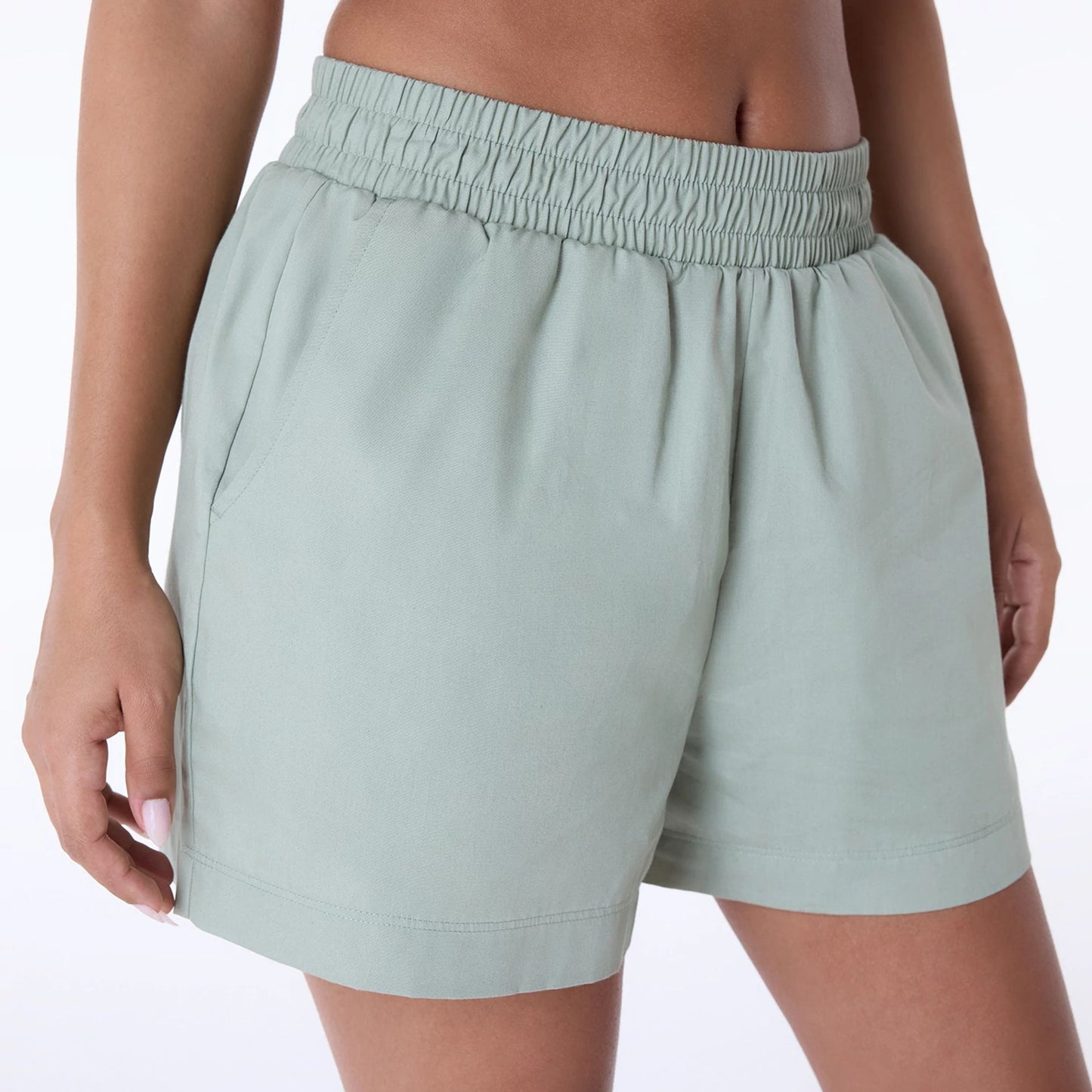 The Female model is wearing Womens New Era Cotton Pastel Green Shorts 6