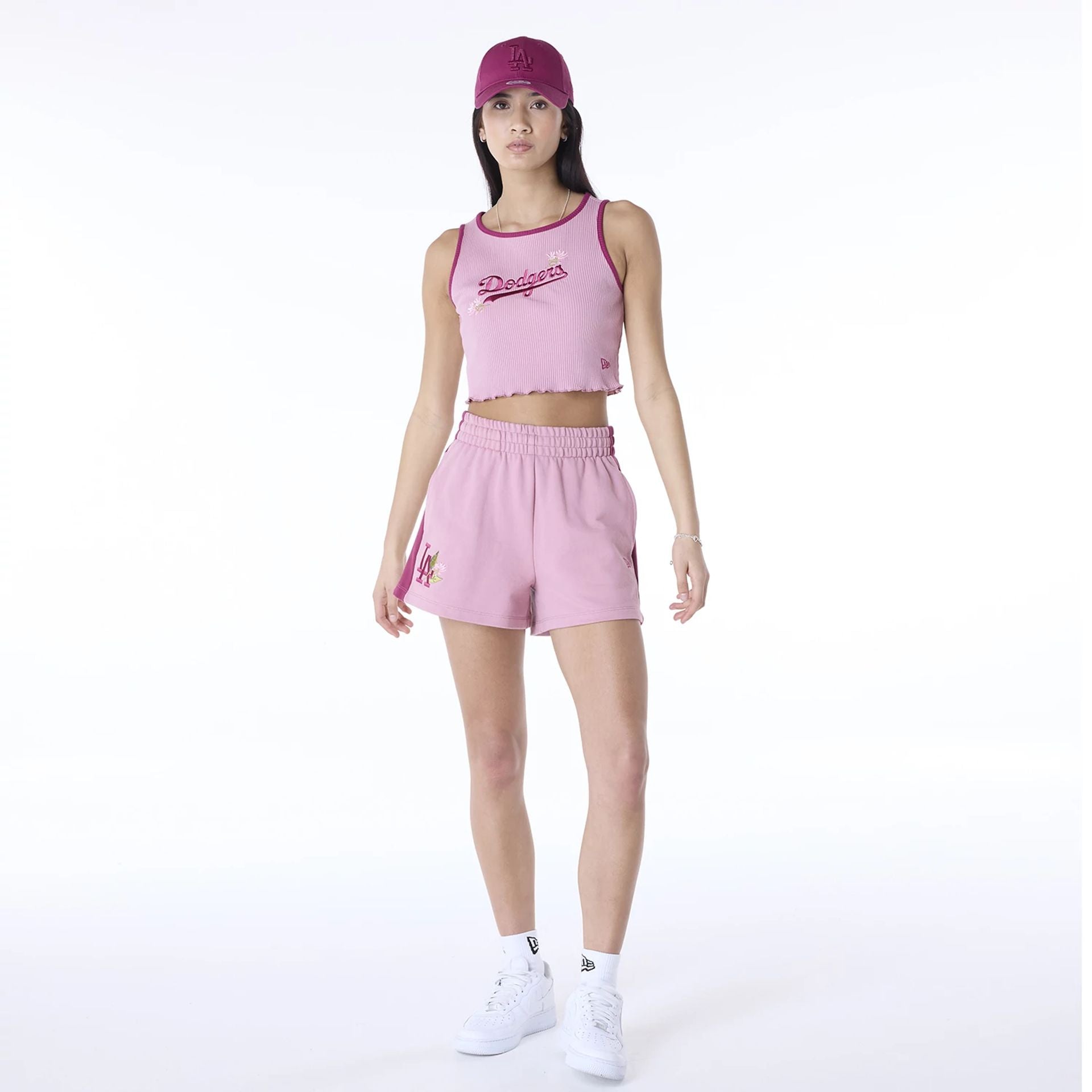 The Female model is wearing LA Dodgers Womens MLB Dark Pink Shorts 7