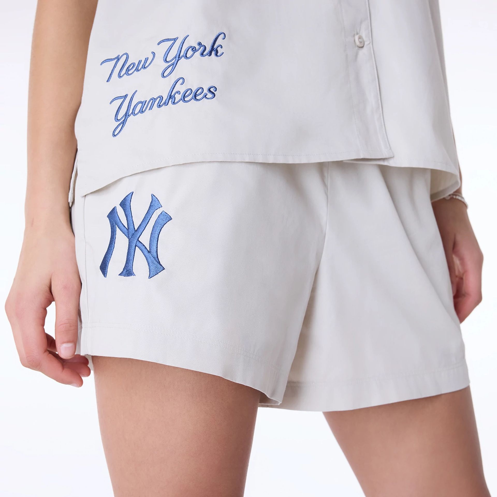 The Female model is wearing New York Yankees Womens MLB Light Beige Shorts 7