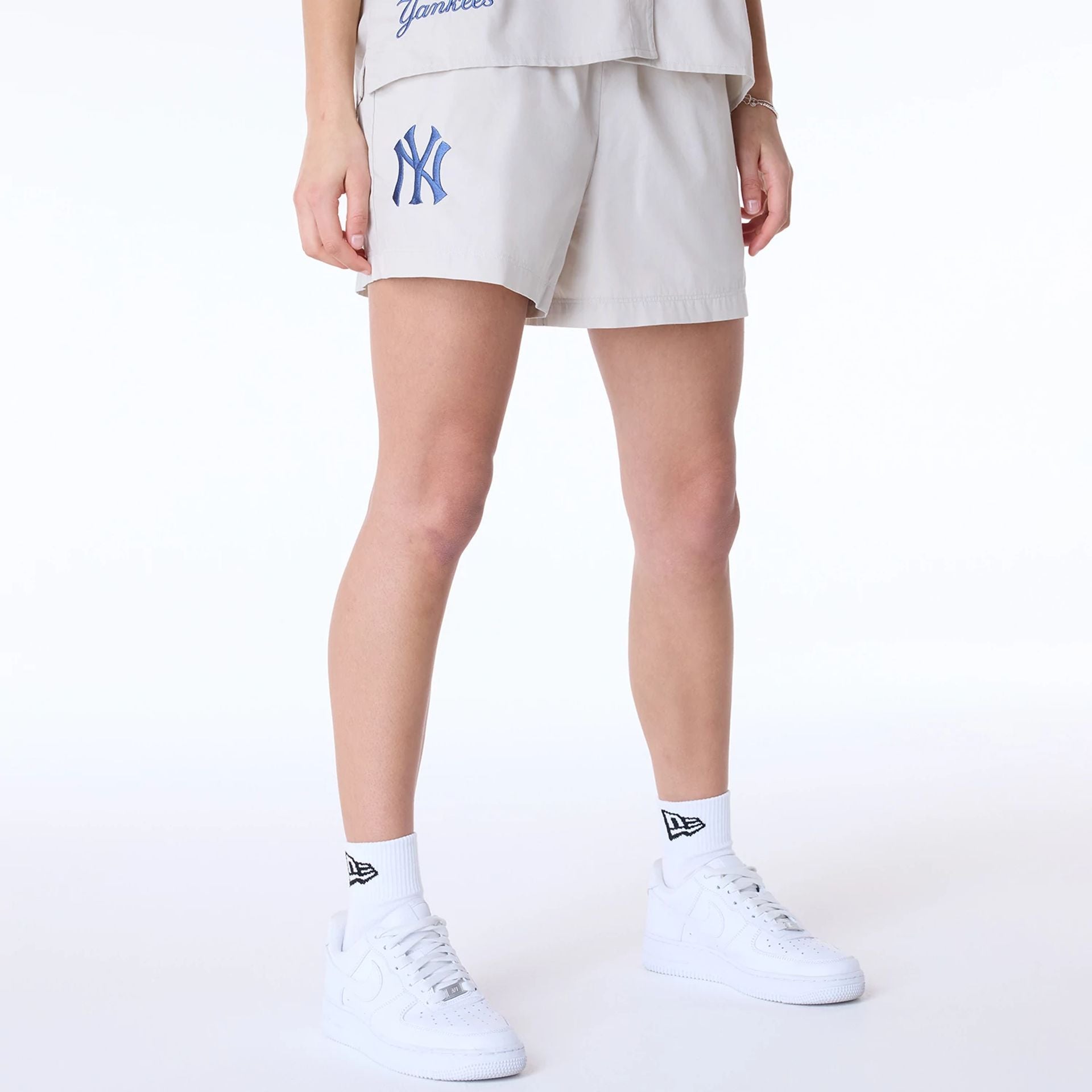 The Female model is wearing New York Yankees Womens MLB Light Beige Shorts 1