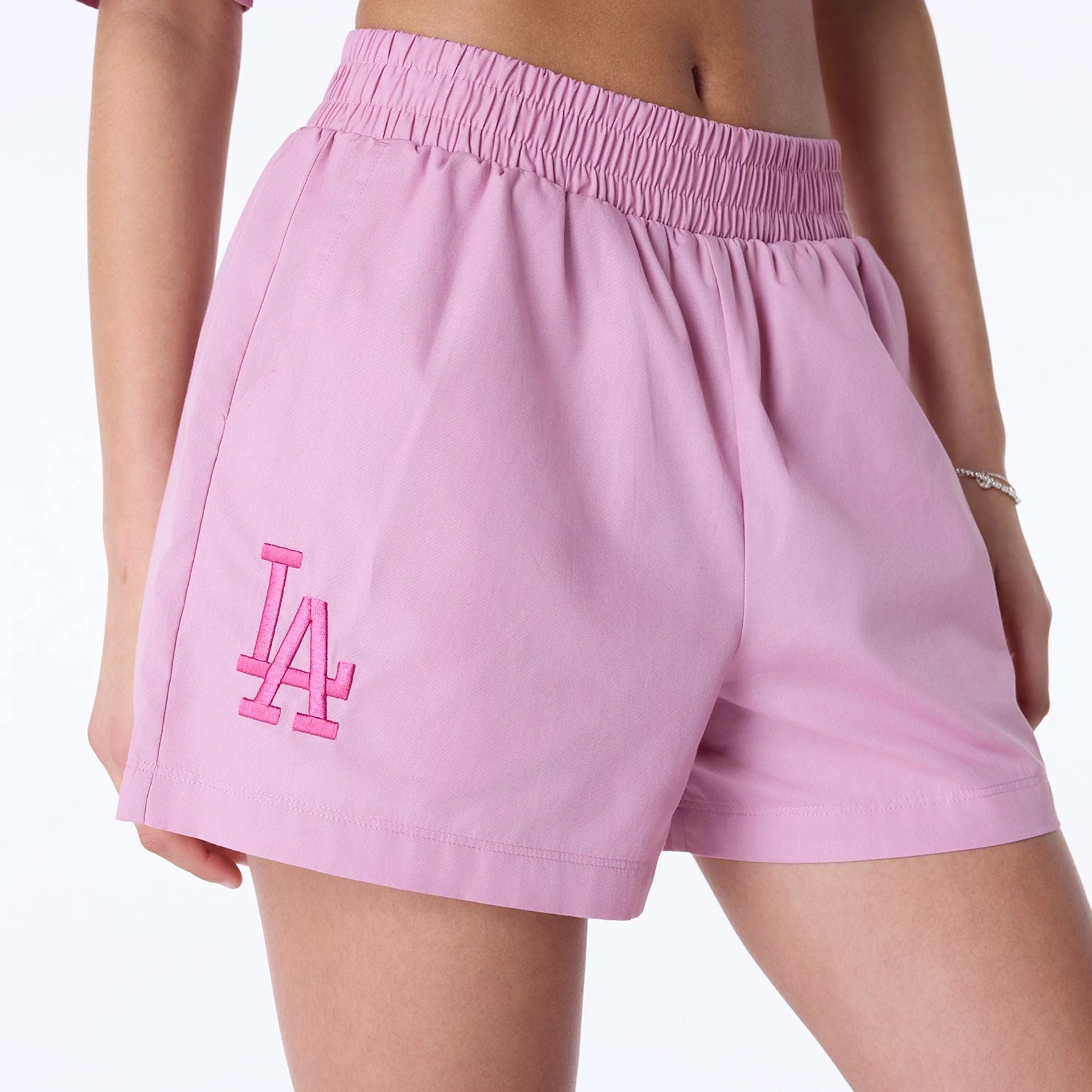 The Female model is wearing LA Dodgers Womens MLB Dark Pink Shorts 2