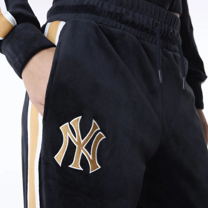 The Female model is wearing New York Yankees Womens MLB Velour Black Joggers 6